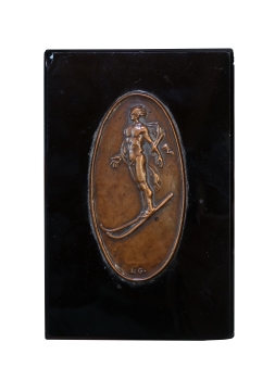 Skier medal in stone